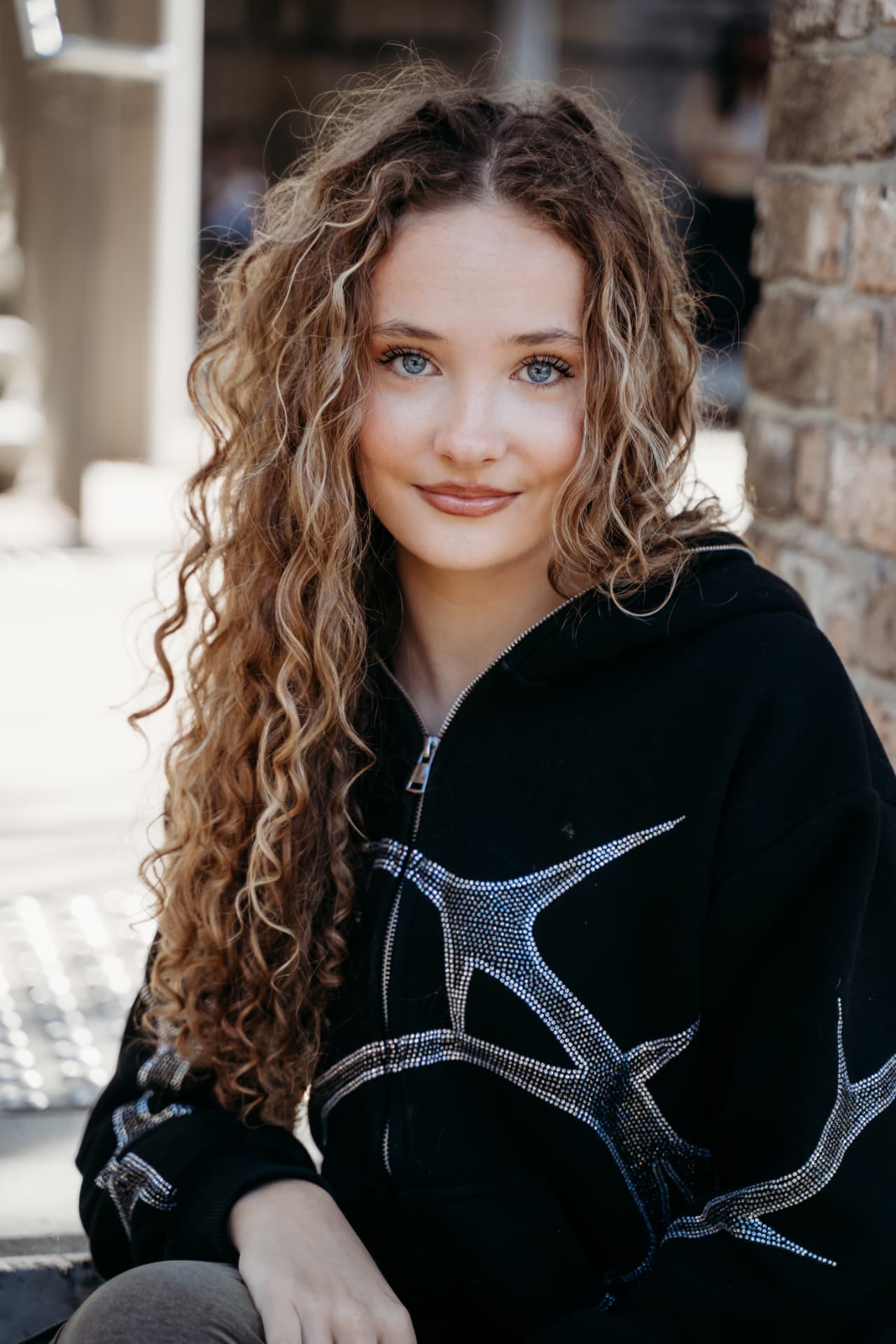 Hazel editorial — Crystal star hoodie · sunlit brick
